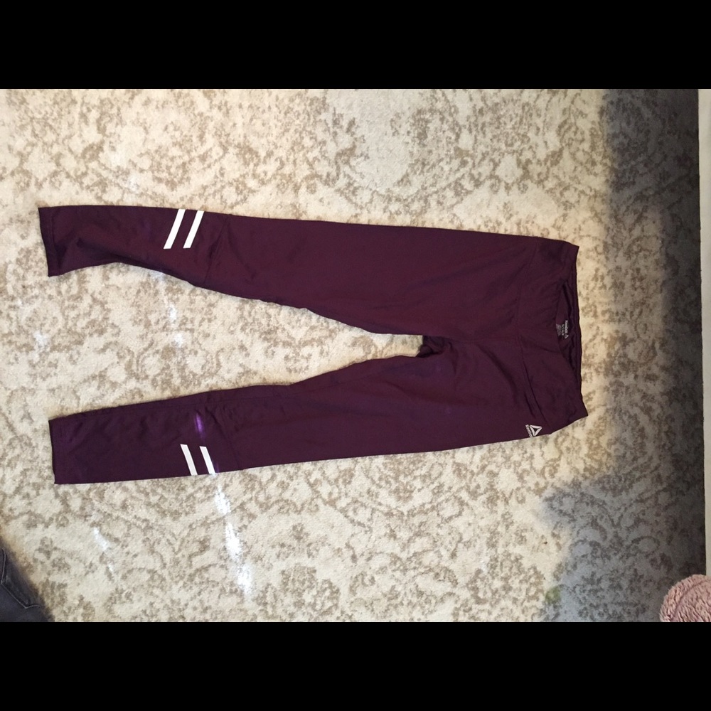 Wine colored Rebok leggings.